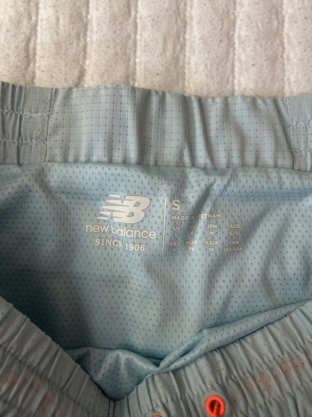 New Balance Light Blue Mesh Running Shorts with Orange Eyelets - Picture 2 of 8